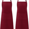 A set of two solid maroon kitchen aprons with pockets.