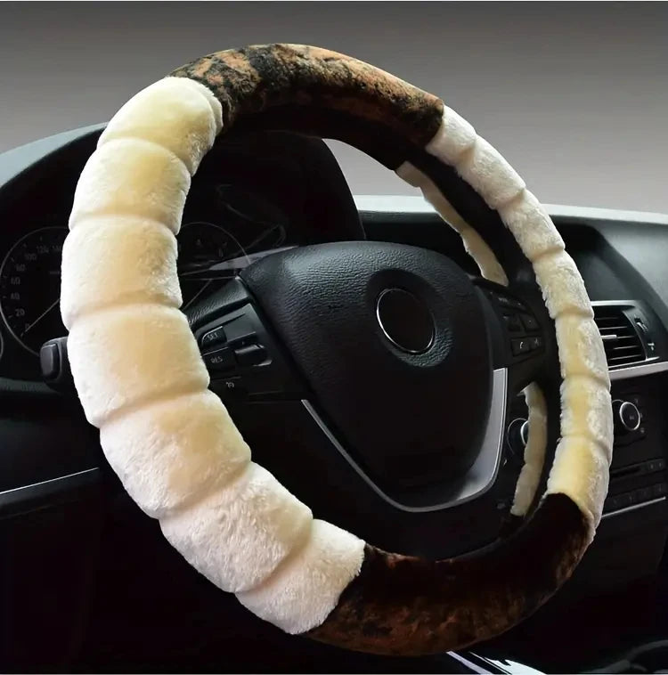 A close-up of a steering wheel covered in brown leather and white plush material.