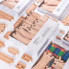 A collection of wooden train track pieces and expansion packs for building trains.