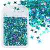 A white plastic pouch filled with iridescent holographic star sequins scattered on a white background.