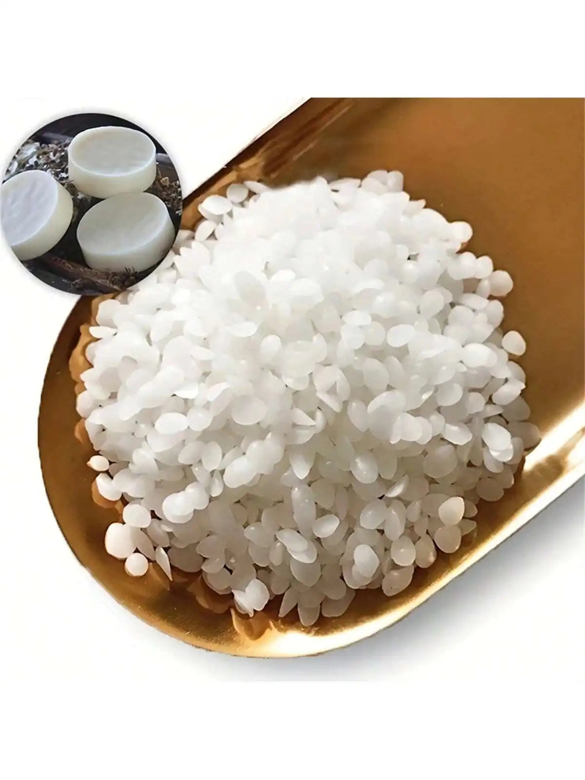 White natural soy wax granules in a gold-colored dish with small white wax pieces.
