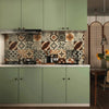 A kitchen cabinet and backsplash featuring matte green vinyl film and patterned tile work.