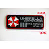 Black aluminum alloy honeycomb metal sticker with a red and white umbrella logo and text on it