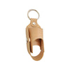A tan PU leather inhaler case with a keyring attached.
