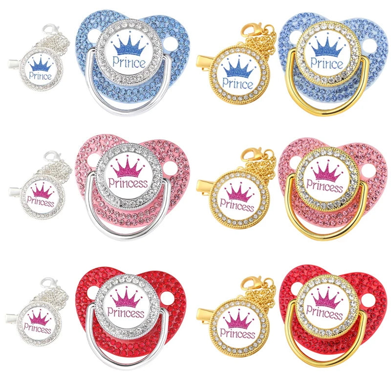 A set of crystal rhinestone pacifier chain clips and silicone nipples in various colors including blue, pink, and gold.