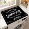 A laundry room with a black sign on the top of a white washing machine and dryer, labeled Loads of Fun Laundry Room.