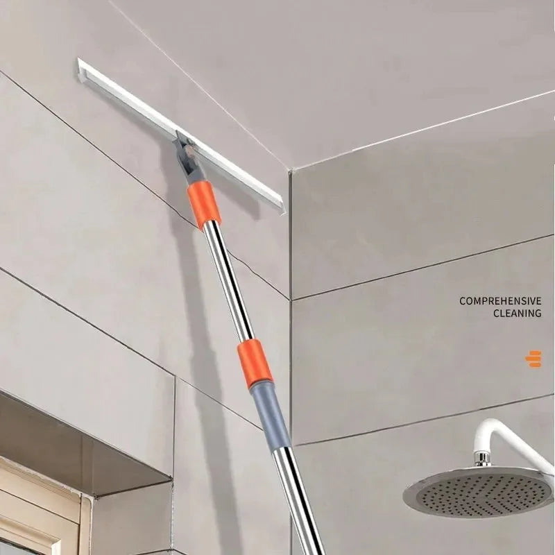 A silicone squeegee broom with an aluminum handle is shown being used to clean a ceiling corner.