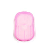 A pink portable disposable soap tablet container.