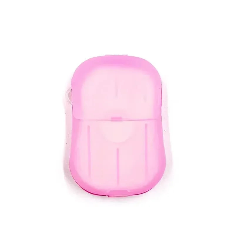 A pink portable disposable soap tablet container.