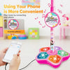 A pink microphone stand with a colorful base and light-up features, demonstrating how to play music using a phone.