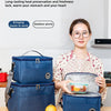 A woman holds a blue insulated lunch bag on a wooden table, demonstrating its features for food preservation.