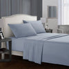 A light blue bedding set featuring a headboard, flat sheet, fitted sheet, and pillows in a bedroom setting.
