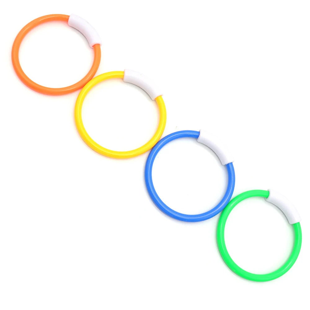 A set of three colored rings, orange, yellow, and green, used for pool dive and grab play.