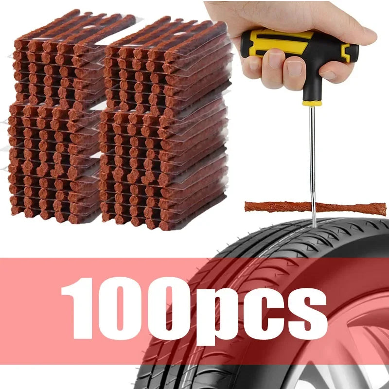A hand uses a tool to insert a repair patch from a stack of tire repair patches onto a tire.