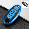A blue TPU key fob cover with a black protective case and various buttons shown on a dark surface.