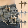Silver and gold Y2K star-shaped clips used to tighten jeans at the waist.