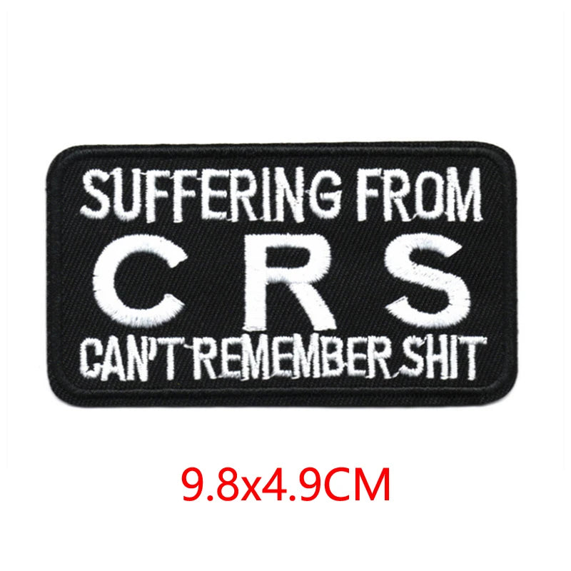 Black embroidered iron-on letter patch with white text reading SUFFERING FROM CRS CAN'T REMEMBER SHIT