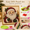 DIY Christmas pearl art kit showing a framed painting of Santa Claus made with beads and wax.