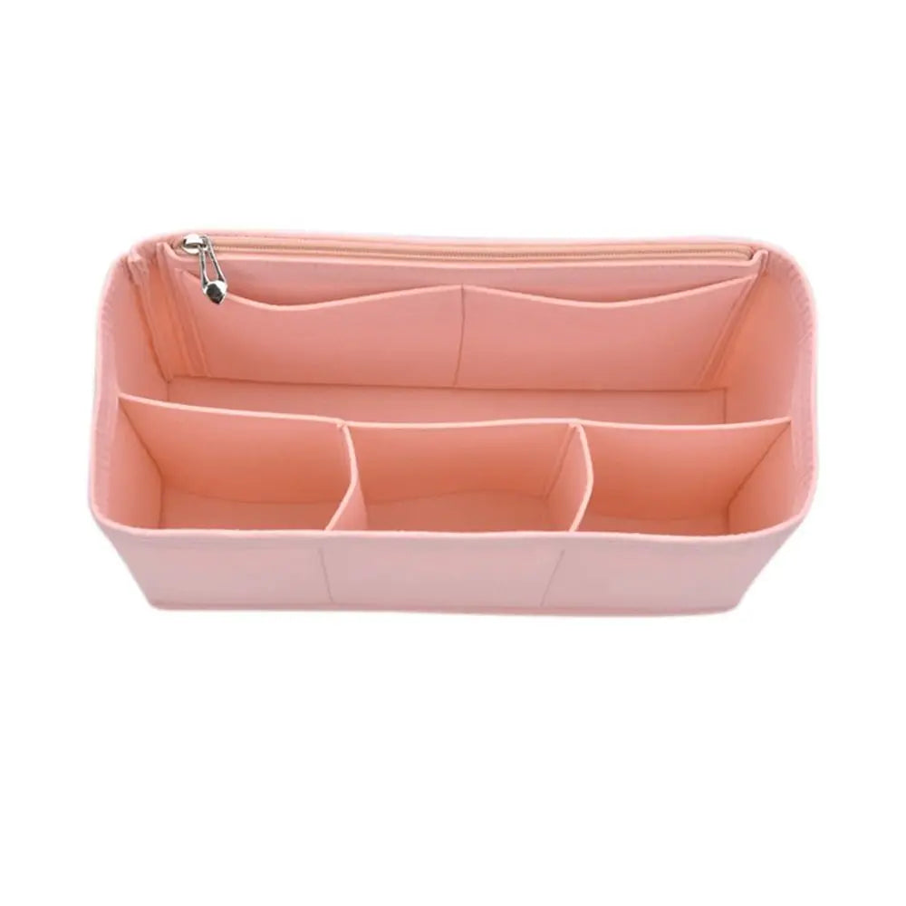 A pink felt insert liner designed to organize and protect handbags.