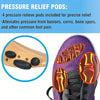 A close-up of a purple shoe showing pressure relief pods placed on the sole of a shoe.