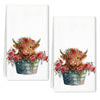 A set of two white kitchen towels featuring a watercolor illustration of a Highland cow with pink and red flowers.