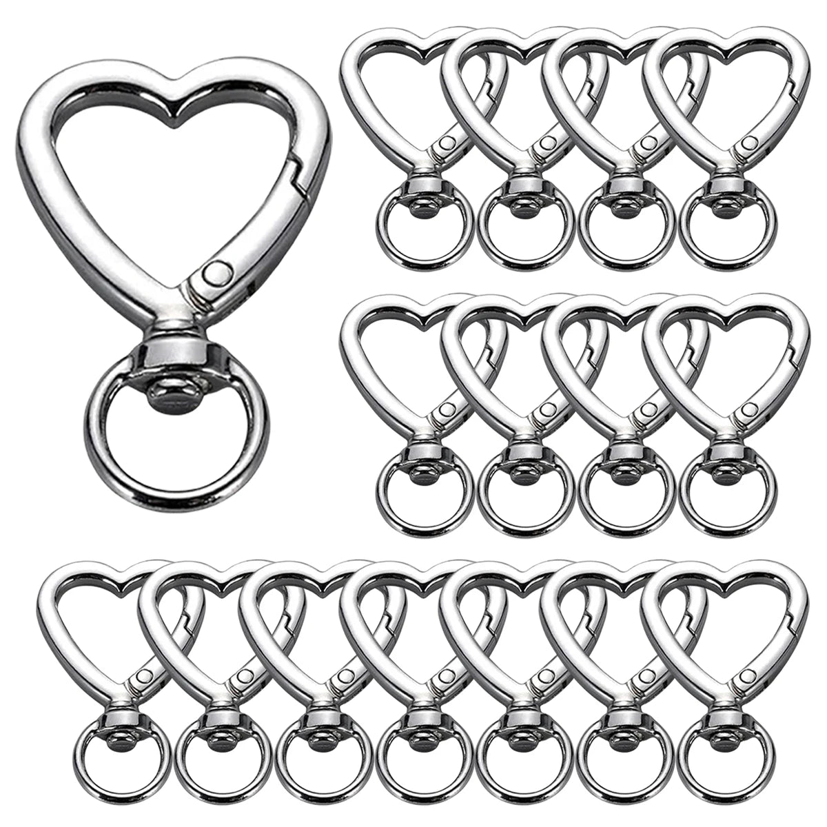 A collection of heart-shaped spring hook keychains made of silver metal.
