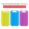 Three colored plastic containers holding 24 disposable toilet brush heads in lemon, ocean, and lavender scents.