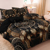 A black and gold tribal dreamcatcher duvet cover set with matching pillowcases displayed on a bed.