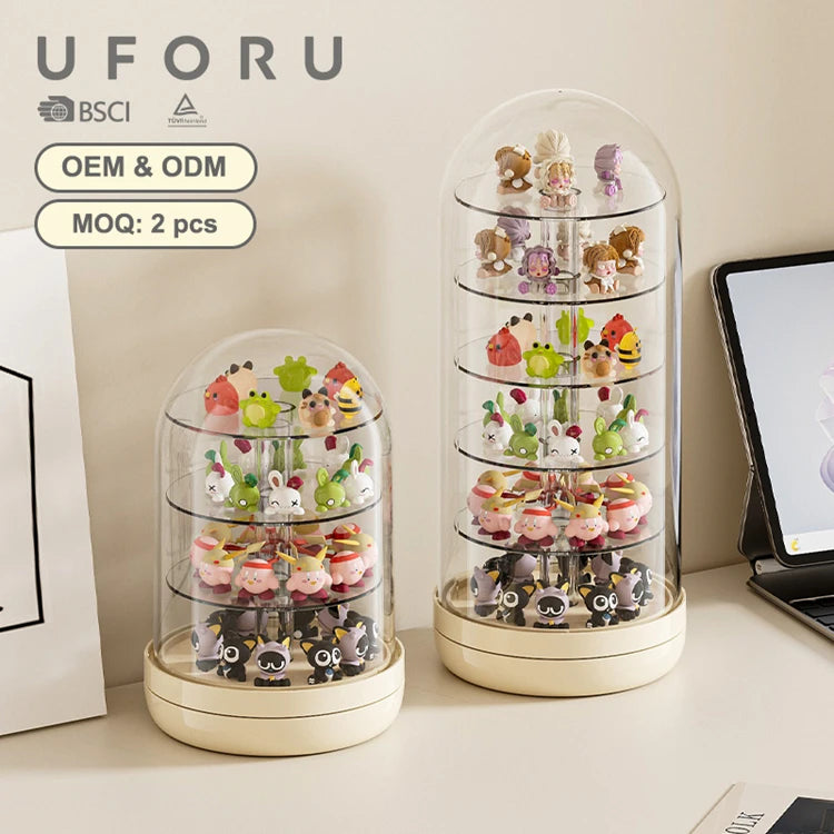 A clear rotating display case filled with various small collectible figurines and keepsakes.