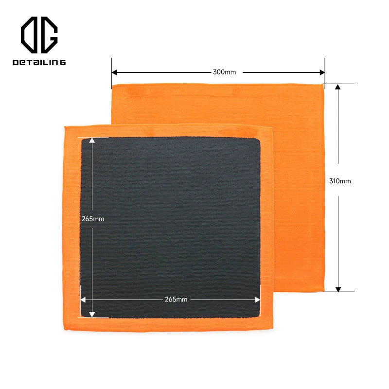 Orange detailing towel with a black square cloth for car paint decontamination