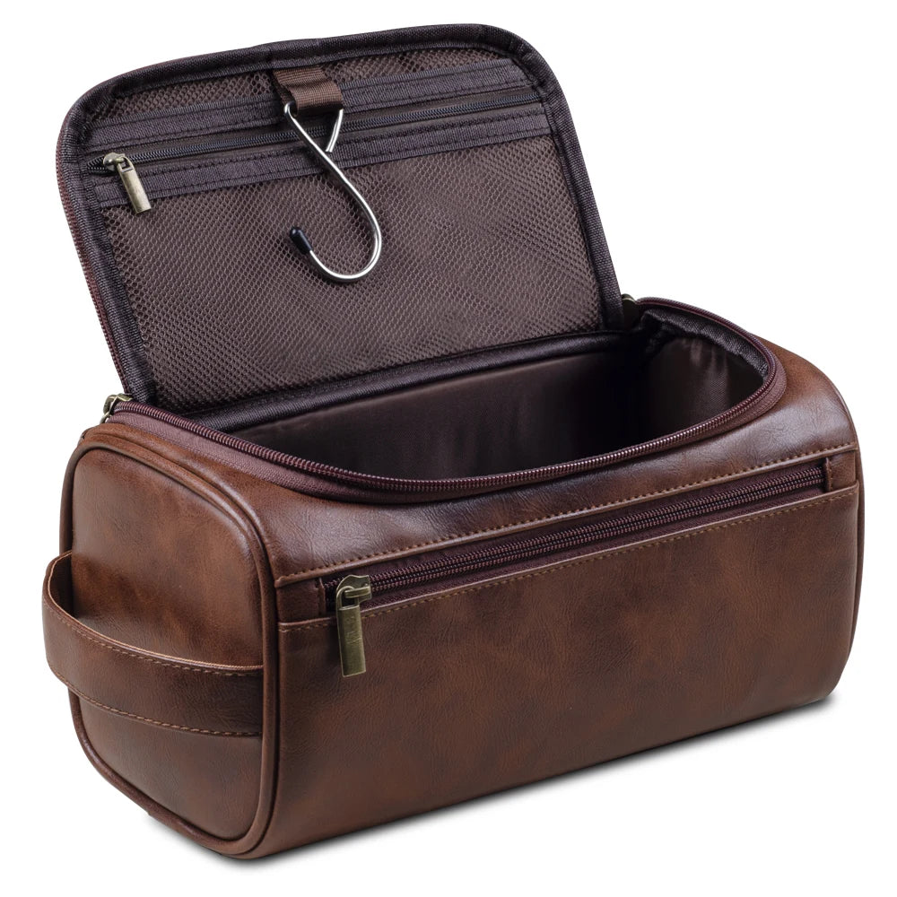 A brown leather toiletry bag with a hinged lid and zippered compartment is shown open.