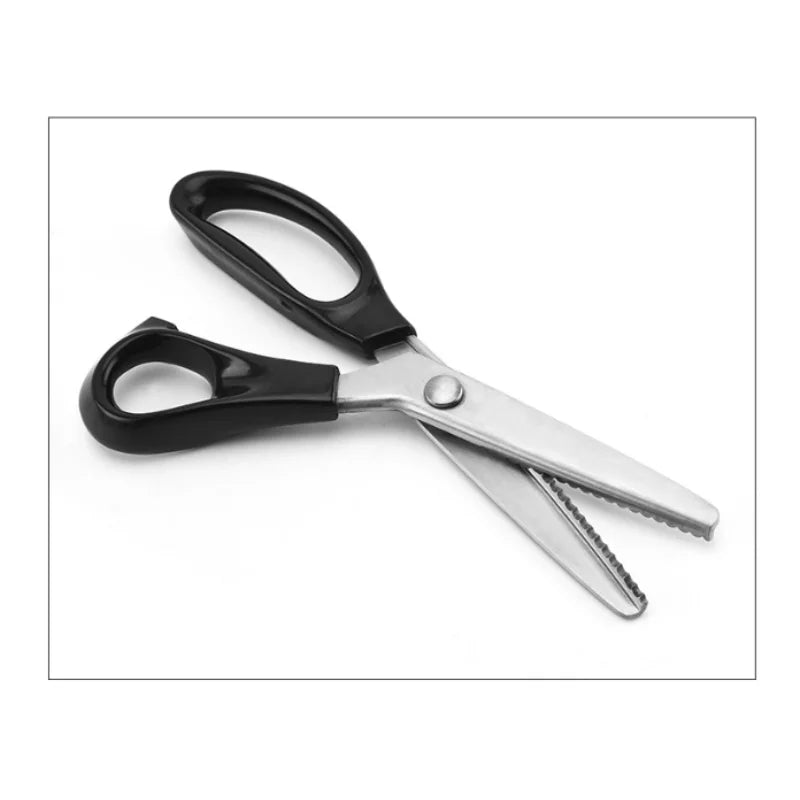 A pair of professional scissors with black handles and silver blades for fabric and crafts.