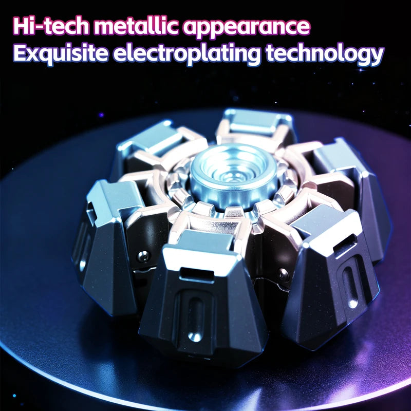 A metallic fidget spinner with a multi-faceted design resting on a dark surface.