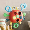 A colorful silicone pull string sensory toy with multiple rings and pull strings for babies.