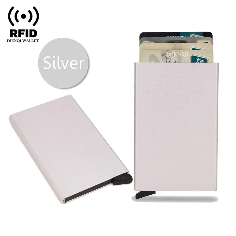 A silver RFID wallet featuring a slim metal design and pop-up card holder for protection.