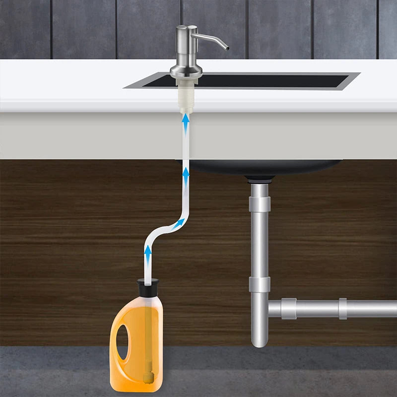Stainless steel under-sink soap dispenser with an extension tube connected to a kitchen sink.