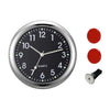 A silver mini car vent quartz clock face with black dial and luminous hands, accompanied by three red buttons and a black kno