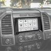 Interior view of a truck dashboard showing a carbon fiber grain center console trim cover and infotainment screen.