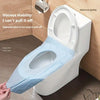 A disposable toilet seat liner is being placed on a white toilet, demonstrating its strong adhesion.