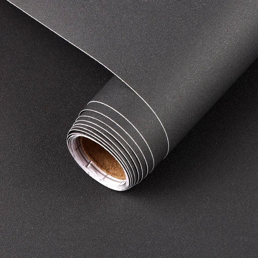Roll of self-adhesive matte green vinyl film for furniture and wall renovation