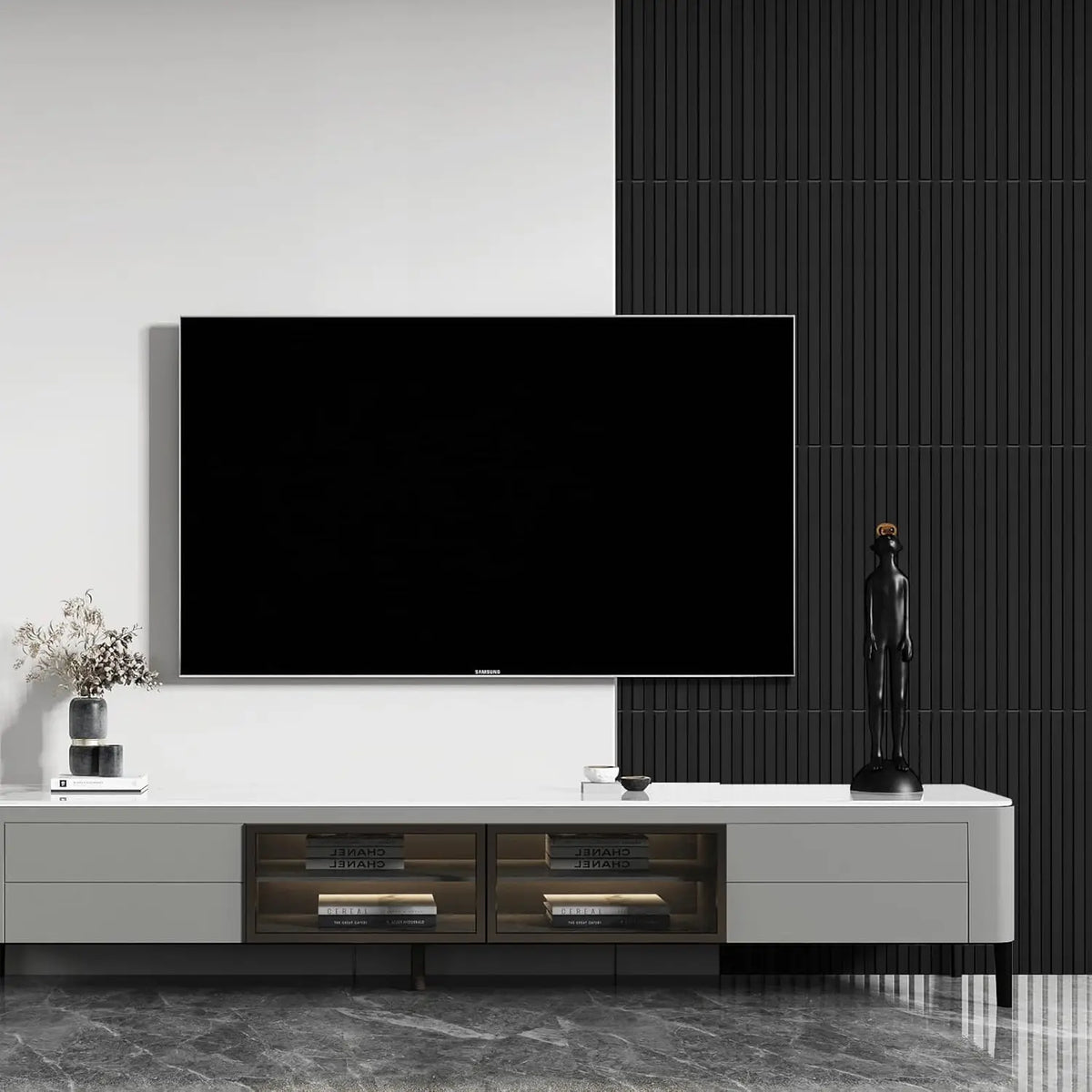 A modern interior featuring a large black television mounted on a white console against dark gray slat wall panels.