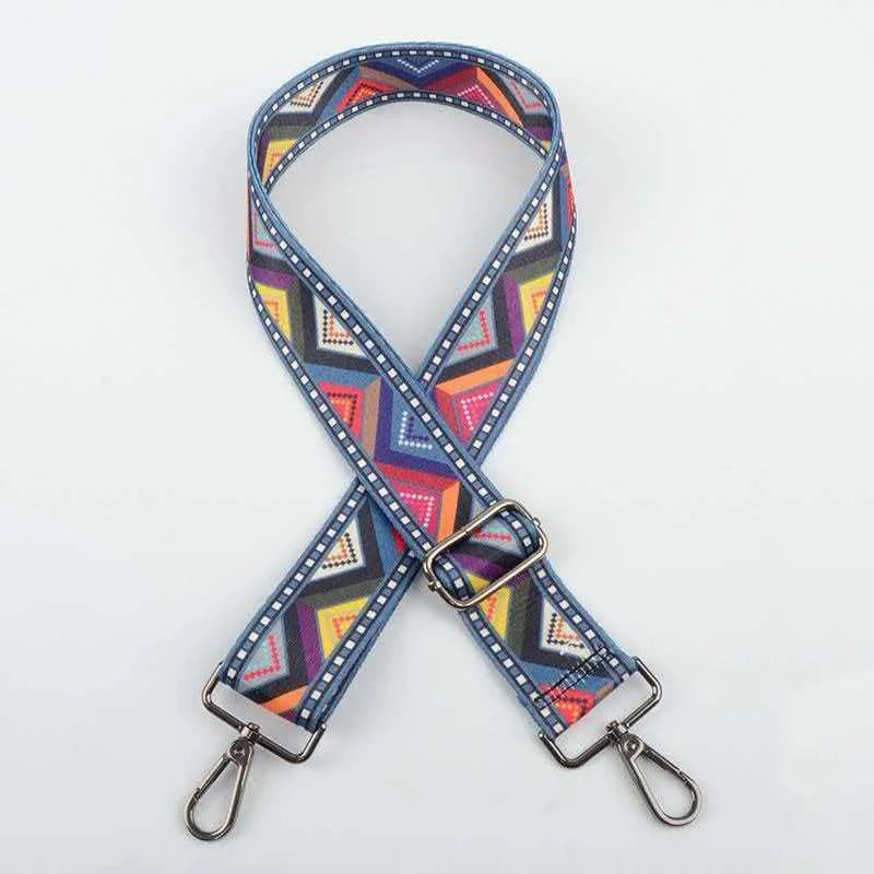 A blue and purple patterned jacquard strap for an elegant crossbody bag.
