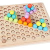 A wooden bead maze puzzle with colorful plastic beads arranged in holes on a light wood board.