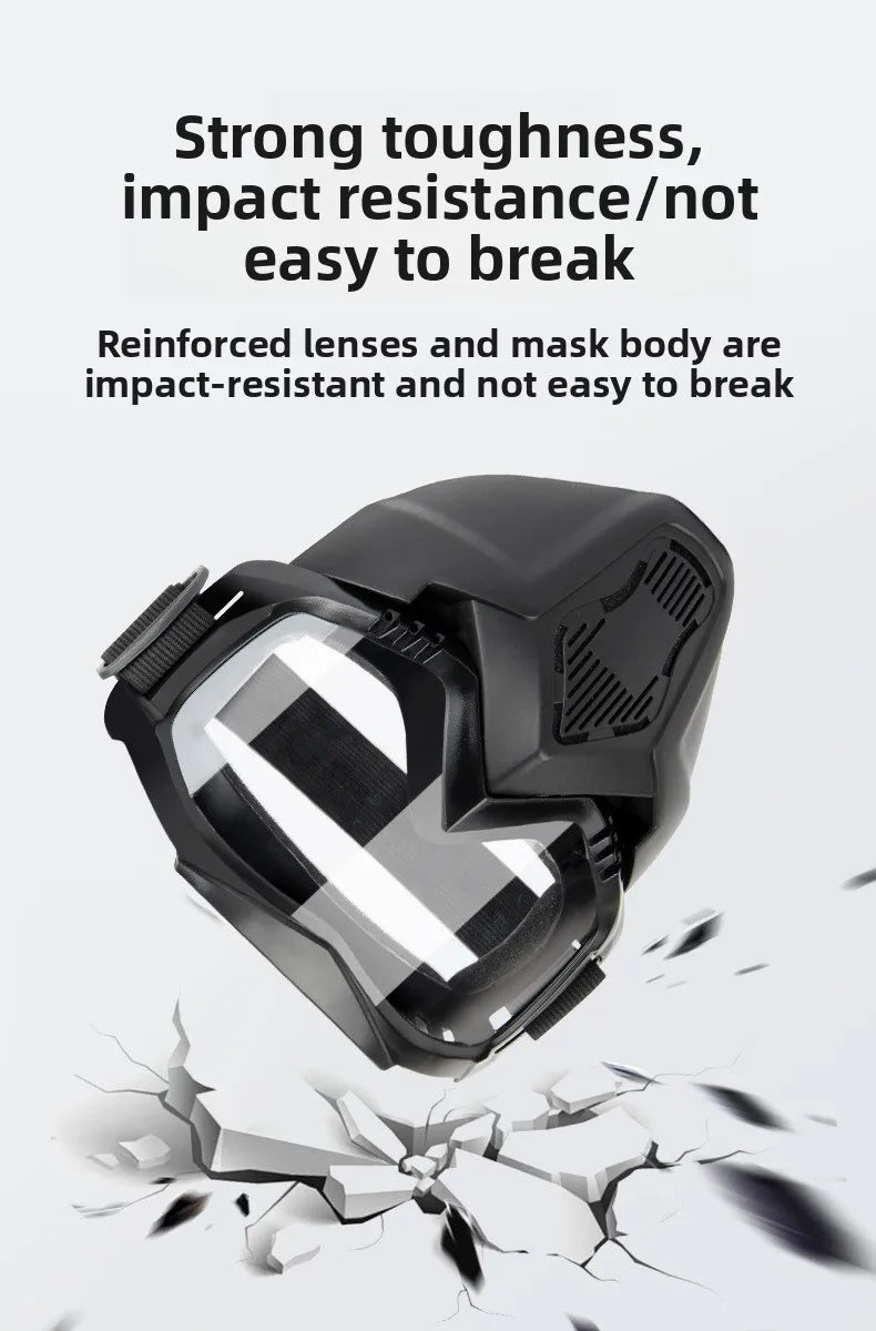A close-up view of a black anti-fog motorcycle goggle with a clear lens, demonstrating impact resistance.