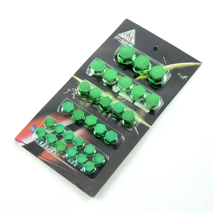 A set of thirty decorative green motorcycle screw cap covers arranged in rows on a black card.