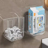 Klares Plastik-WC-Papierspender mit blauer und weißer Box gefüllt mit Toilettenpapier.