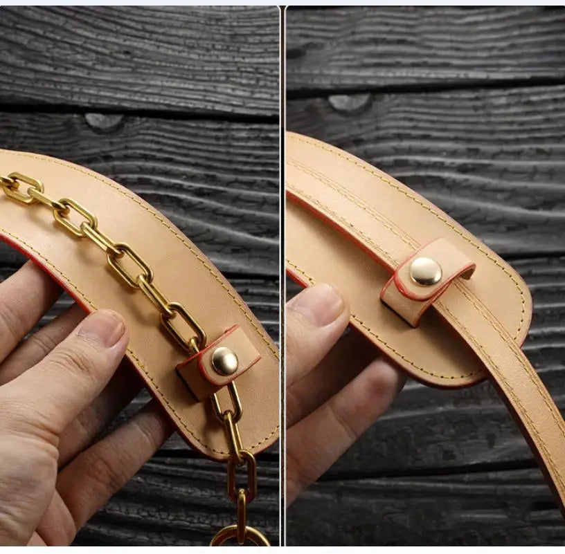 A close-up of a tan genuine leather handbag handle wrap and shoulder pad being held by a hand.