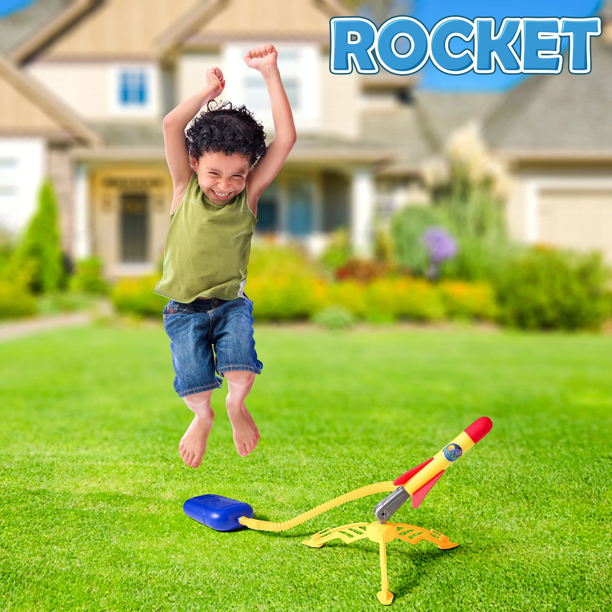 A young boy is launching a yellow and red rocket toy from a blue launcher onto green grass.