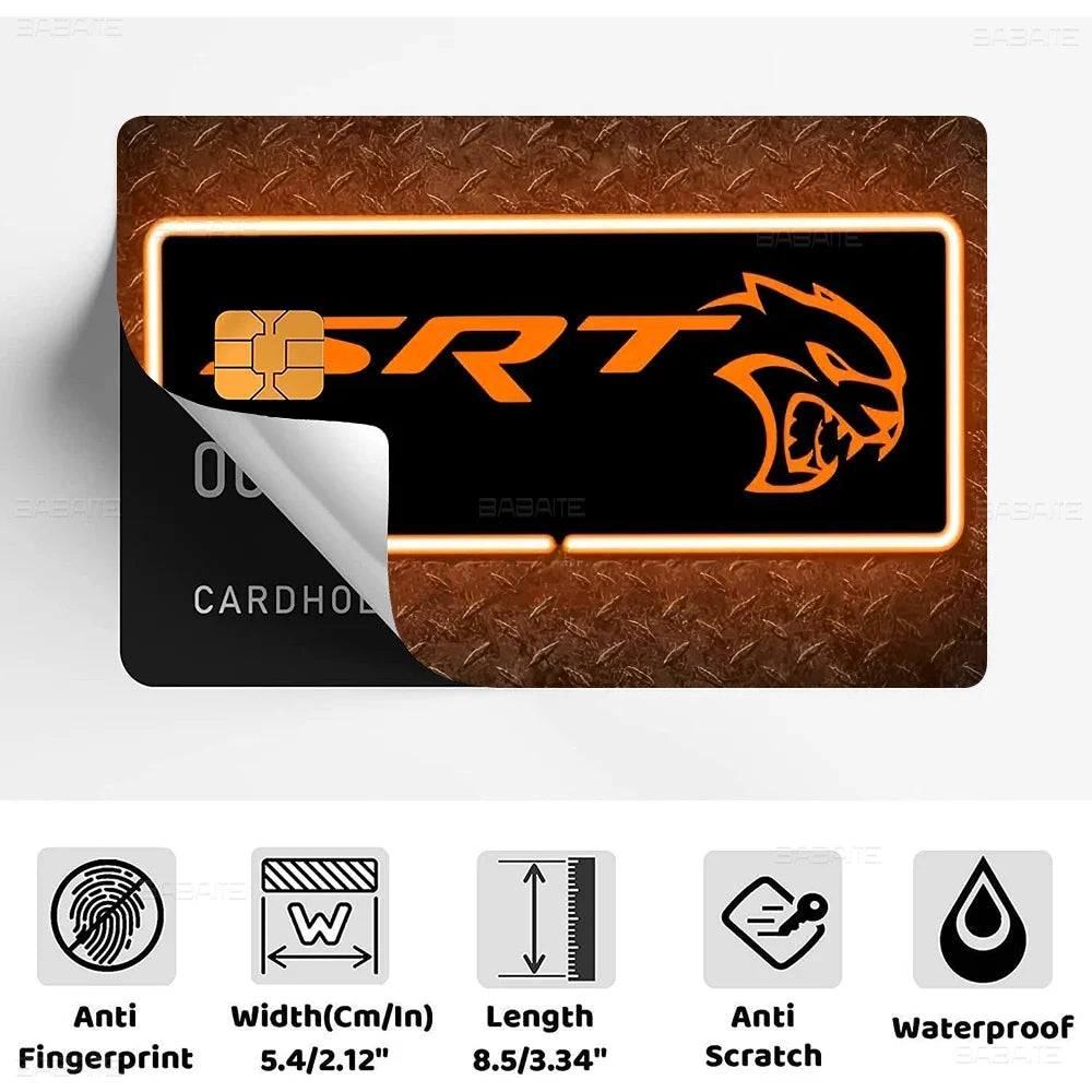 A black credit card skin cover featuring an orange SRT logo and a stylized yellow dragon head on a brown textured background.