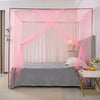 A pink lace canopy mosquito net draped over a bed, creating a romantic enclosure.